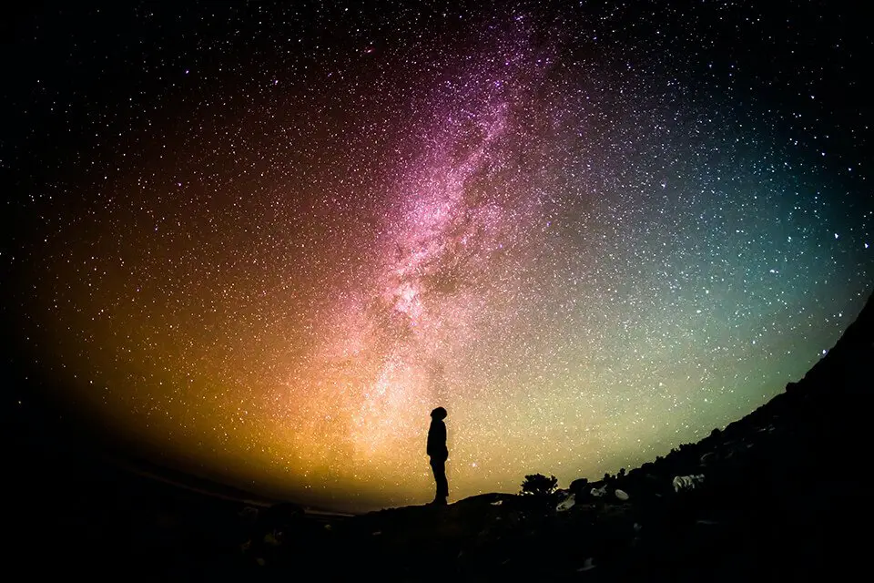 Man staring up in the starry sky