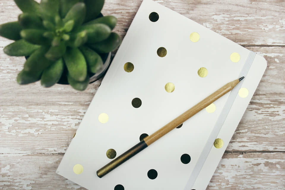 Gratitude journal laying on table