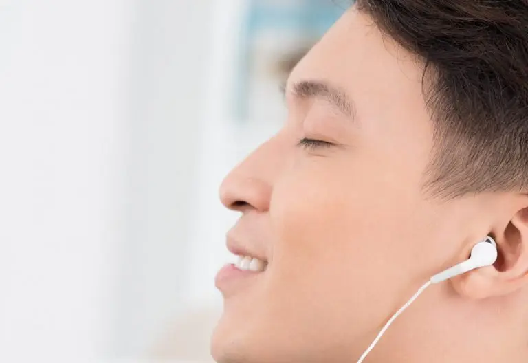 a man with ear buds in his ears.