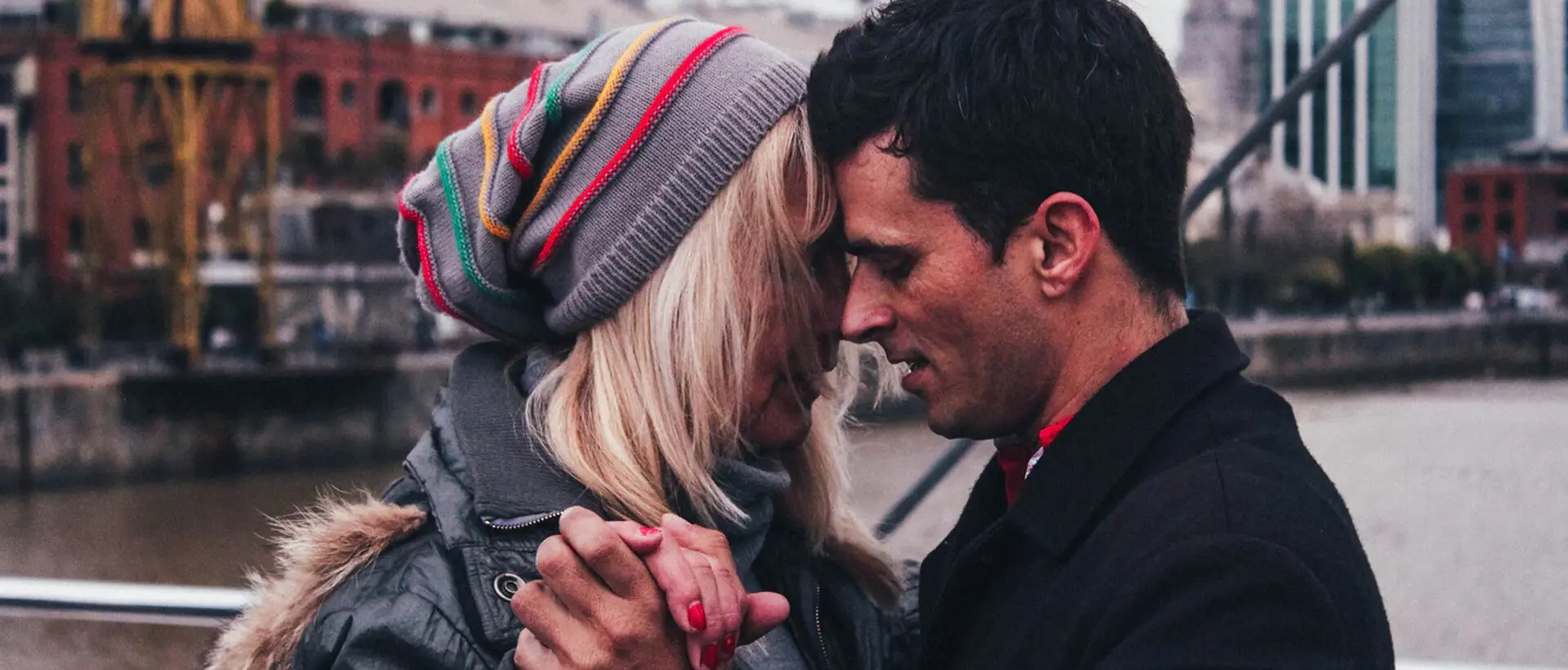 a man and a woman standing next to each other.