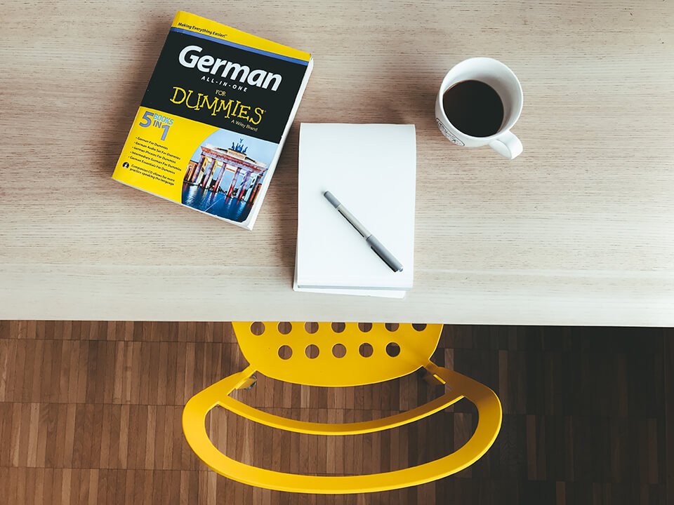 Desk with book on learning to speak German