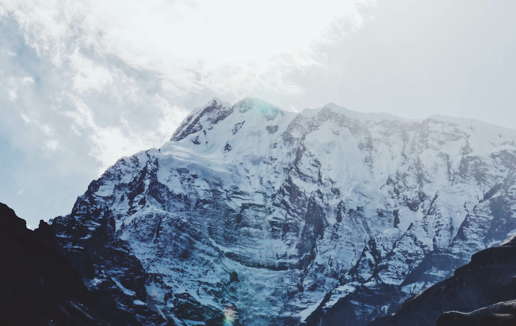 a snow covered mountain with a sky background.