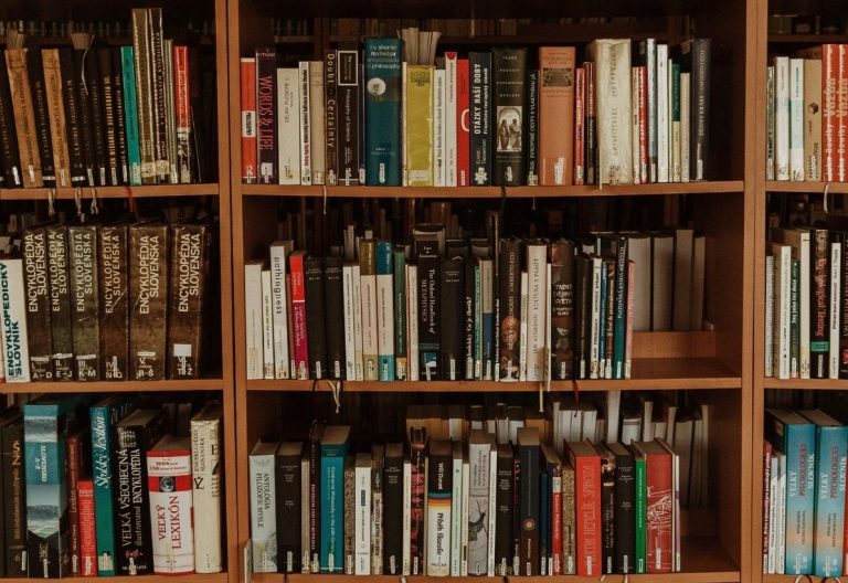 a book shelf filled with lots of books.