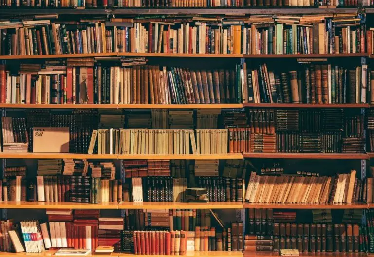 a book shelf filled with lots of books.