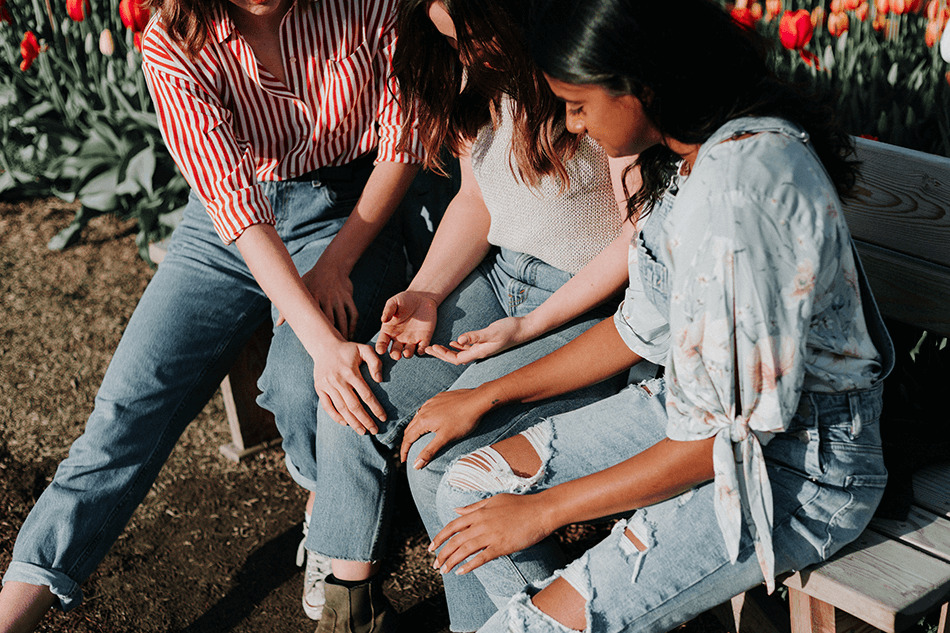 women comforting a woman