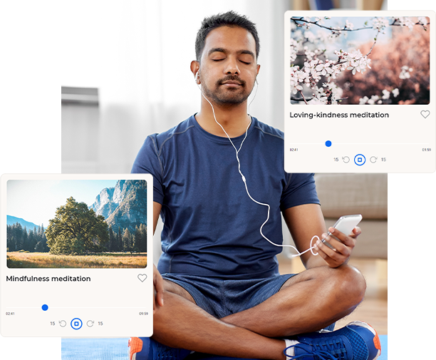 a man sitting in a lotus position while listening to music.