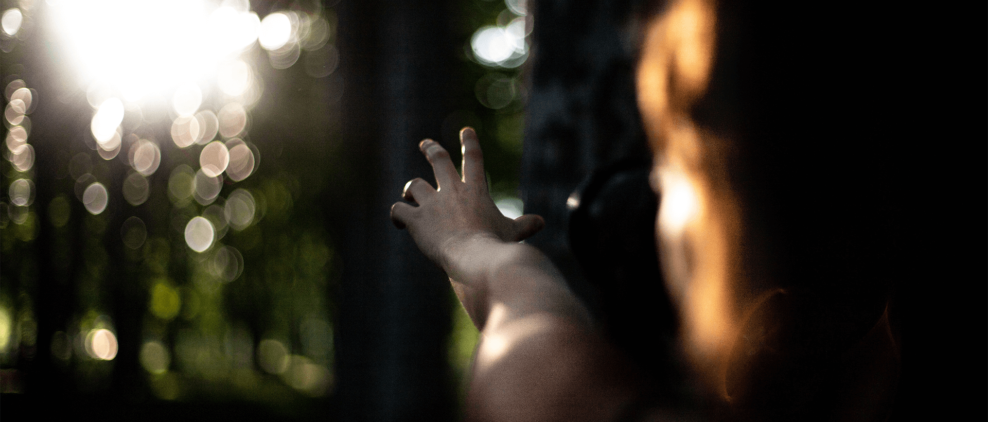 a person holding their hand up in the air.