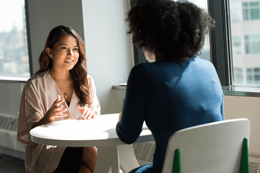 woman interviewing another woman